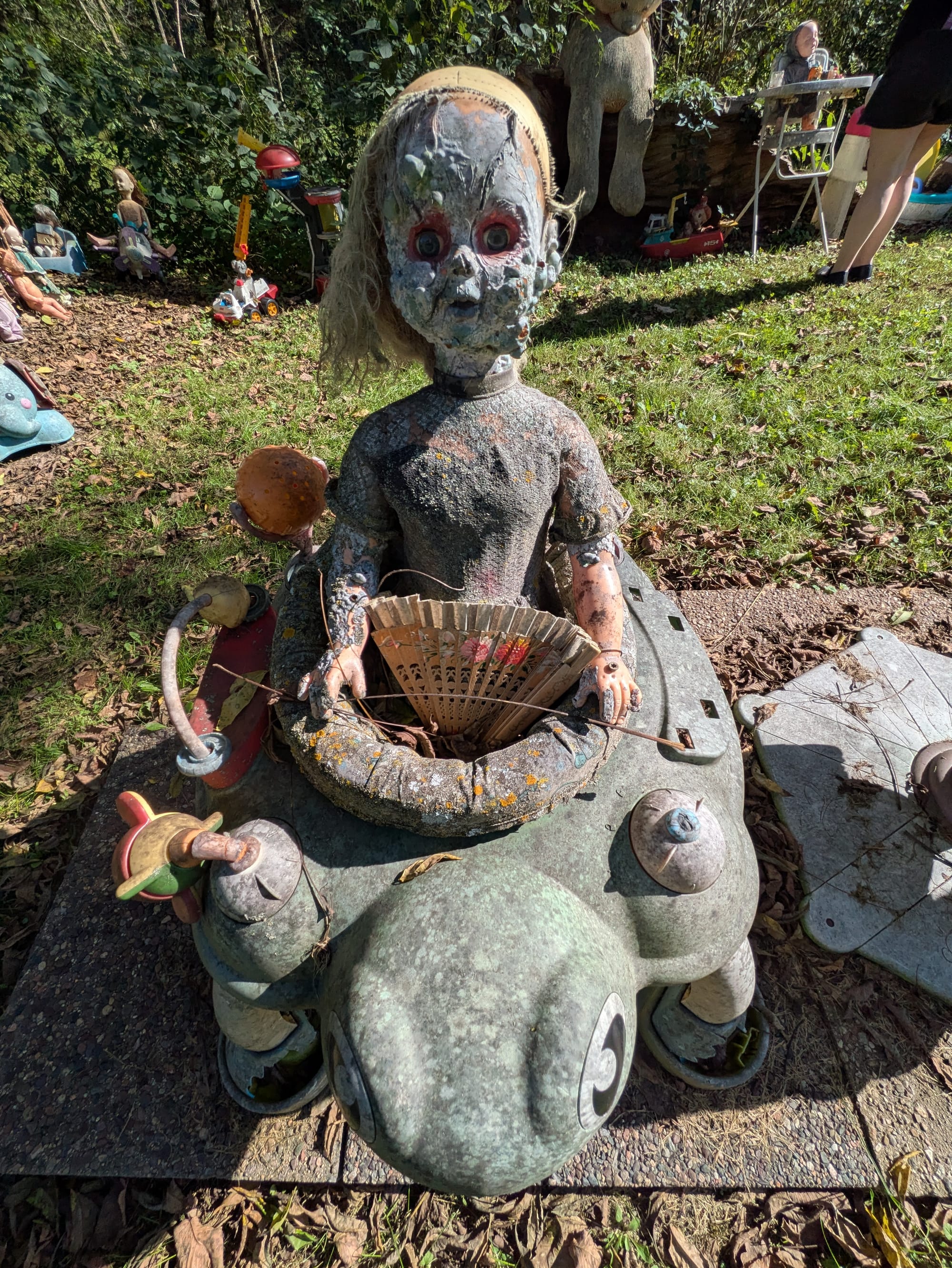 Another creepy ass doll with her face caked in mud