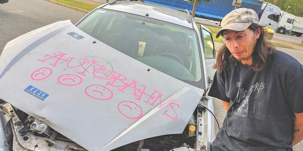 Autobahns next to a totaled and tagged up car