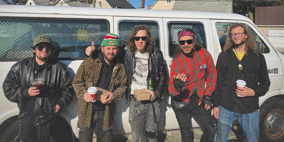 Science Man, the band, by a van