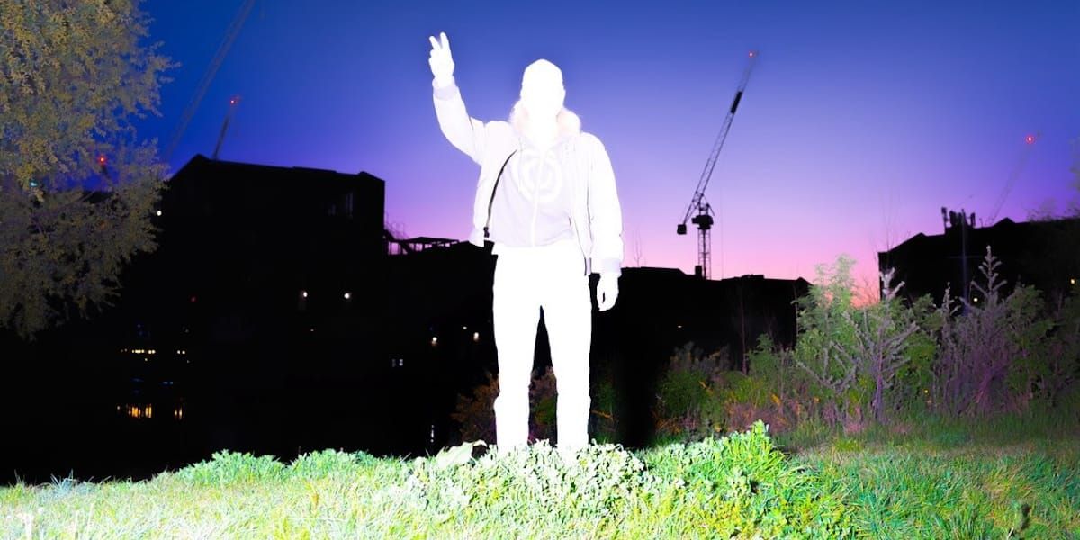 Powerplant washed out by bright light on a landscape, photo by Aria Shahrokhshahi