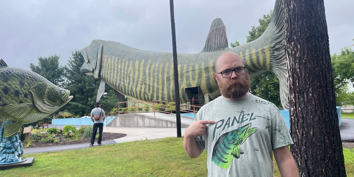 Evan Minsker in the Panel muskie shirt in front of the world’s largest Muskie statue in Hayward, Wisconsin