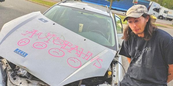 Autobahns next to a totaled and tagged up car