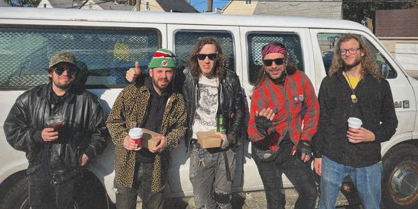 Science Man, the band, by a van