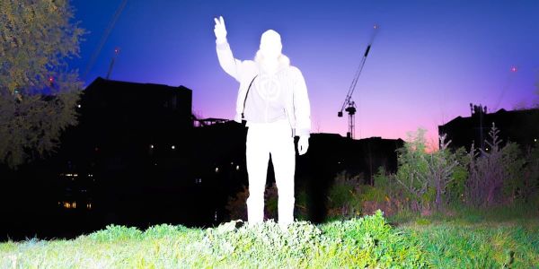 Powerplant washed out by bright light on a landscape, photo by Aria Shahrokhshahi