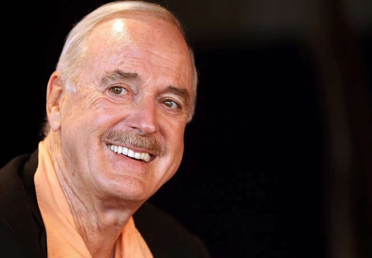 Monty Python Star John Cleese Mocks Hank Azaria’s Apu Guilt with Apology to ‘English People’… but Some Don’t Get the Joke