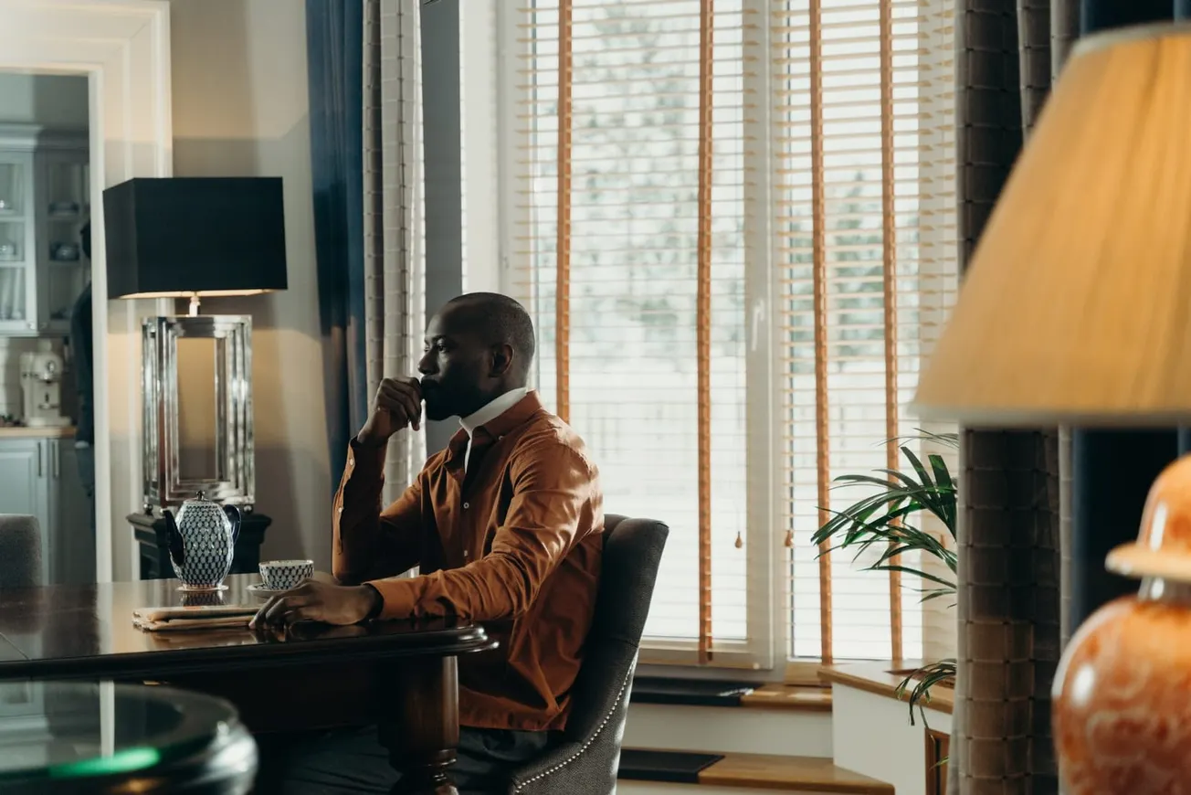 Man Sitting on the Table with Teapot