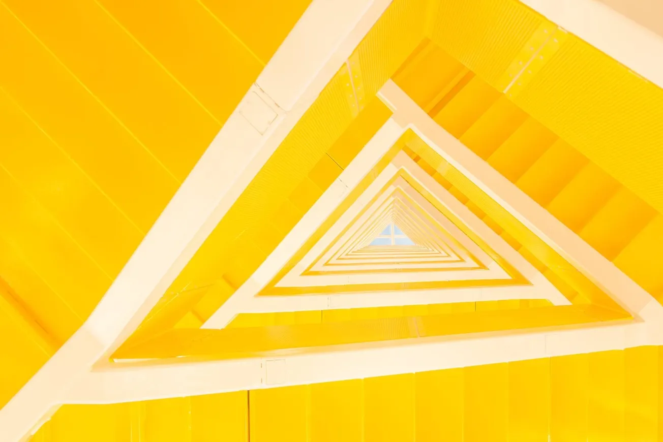 Yellow geometric staircase in contemporary apartment