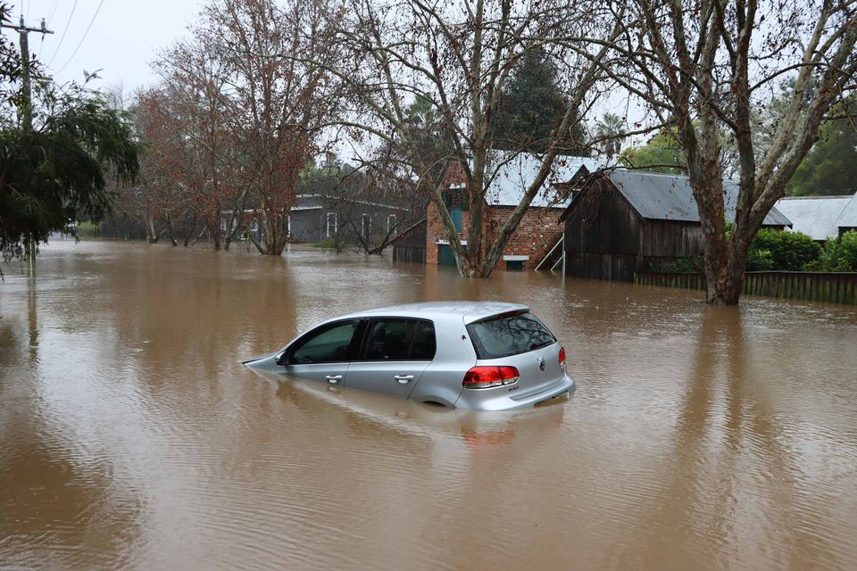 Photo of a flooded car.
