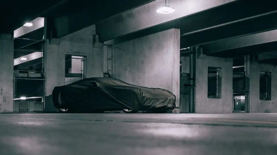 Covered car in a parking garage.