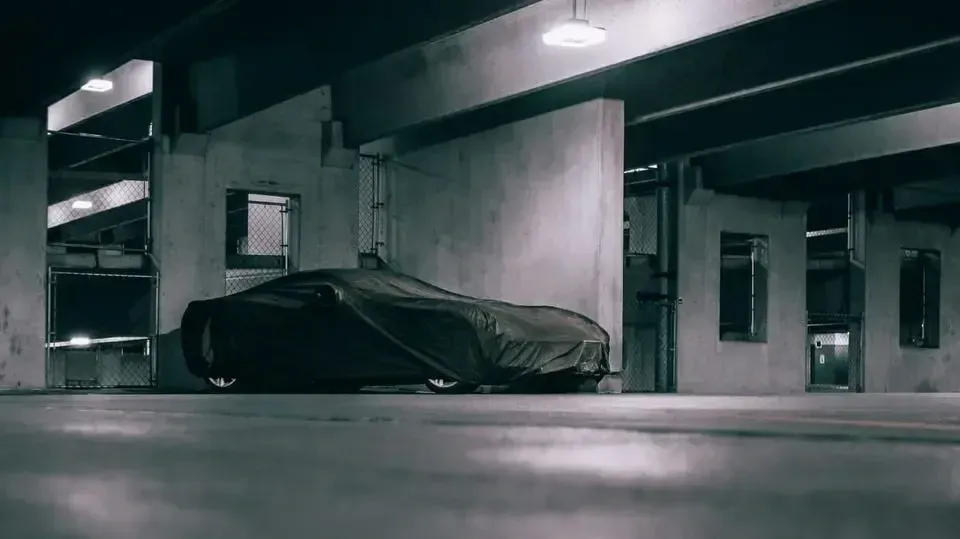 Covered car in a parking garage.