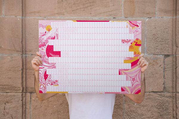 Mockup of a person holding an A1 illustrated yearly calendar. The Forever Calendar, illustrated by Simona Casolari, takes inspiration from the magic of life.
