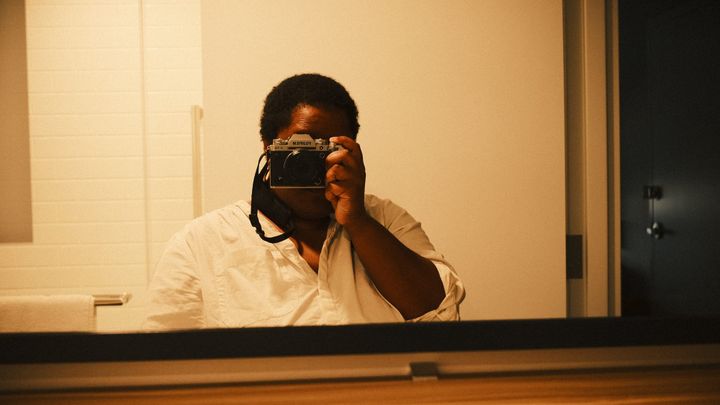 Mirror selfie of Sula with a camera