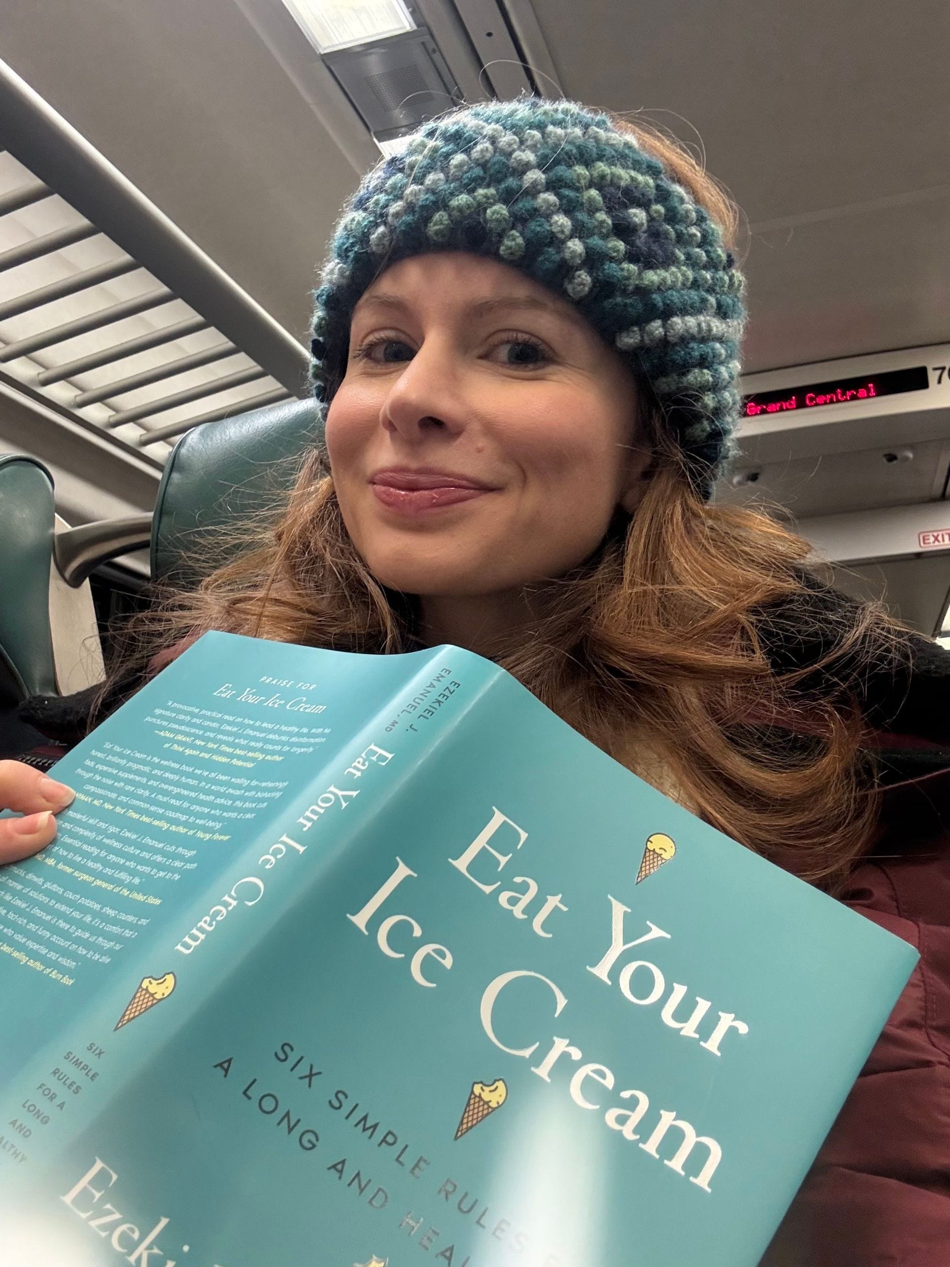 Christina Farr reading a book titled Eat Your Ice Cream: Six Simple Rules for a Long Healthy Life by Ezekiel Emanuel, which comes out Jan 6th