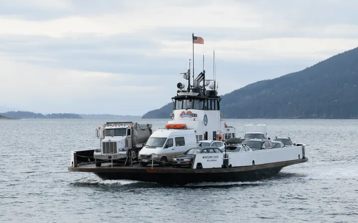 A small car ferry on the water with a tree-covered island behind it.