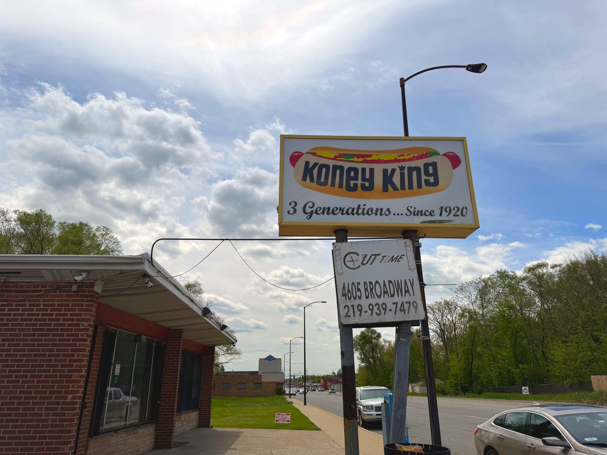 The exterior of Koney King and the hot dog stand's sign.