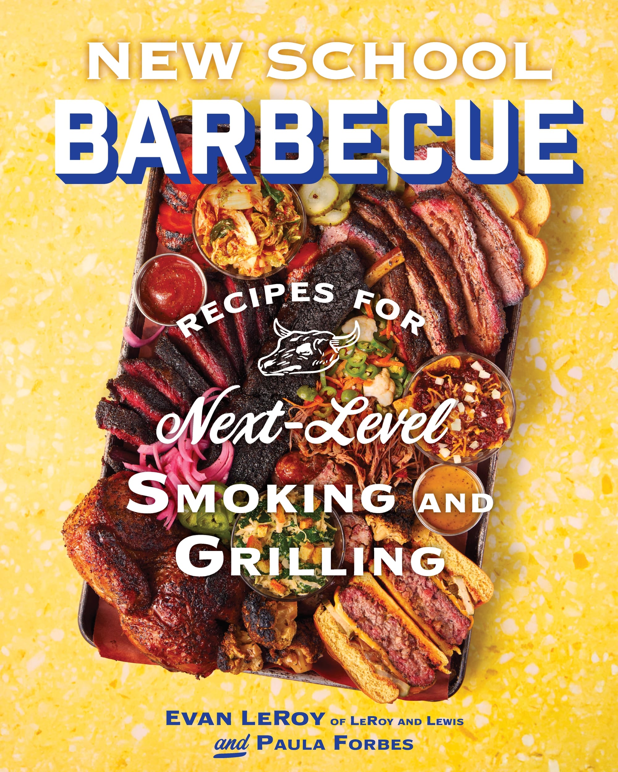 A cookbook features a tray of barbecued meats on the cover.