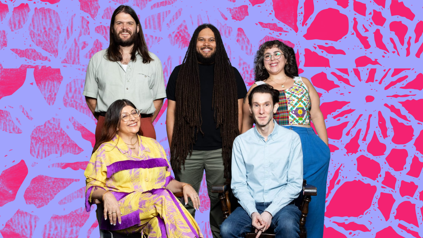 Five people in a portrait, three standing in the back and two seated up front, on a designed background.
