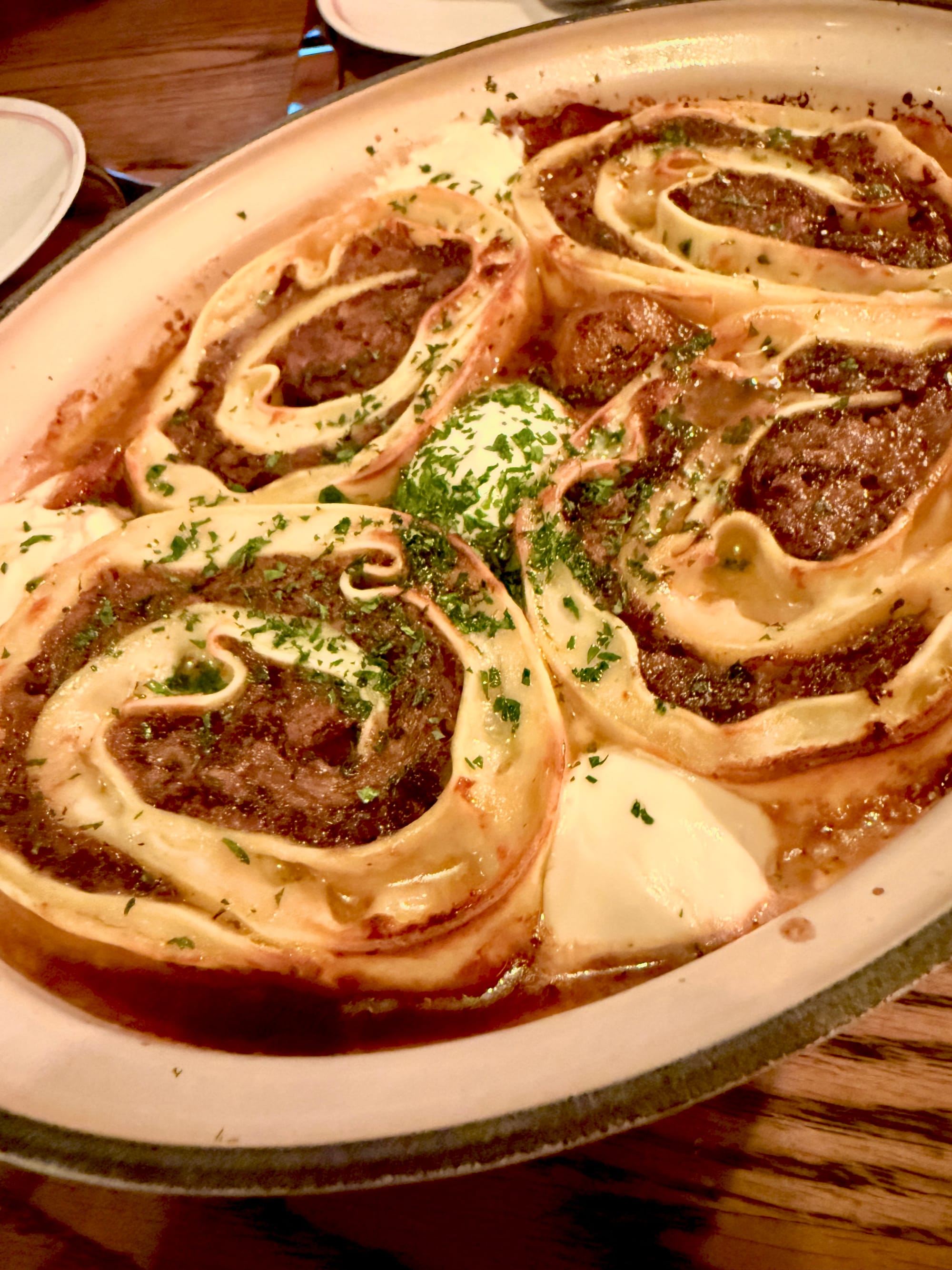 A close-up of a platter of lasagna.