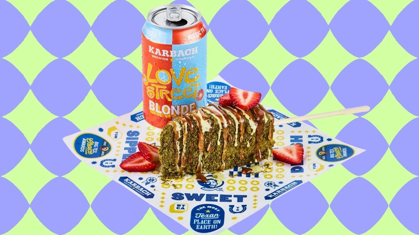 A slice of cheesecake covered in matcha and white chocolate and coated with strawberry compote is served on a stick. Next to it is a can of blonde ale.