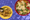 A yellow plate of fried tostones sits in the bottom left corner. In the top right, a bowl of conch stewed in butter sauce.