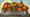 A train car full of oversized naval oranges