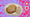 A plate holds a large chicken fried steak covered in brown gravy and a scoop of mashed potatoes.