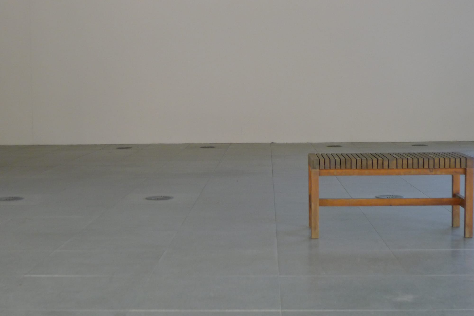 A photo of a lonely bench in an empty office