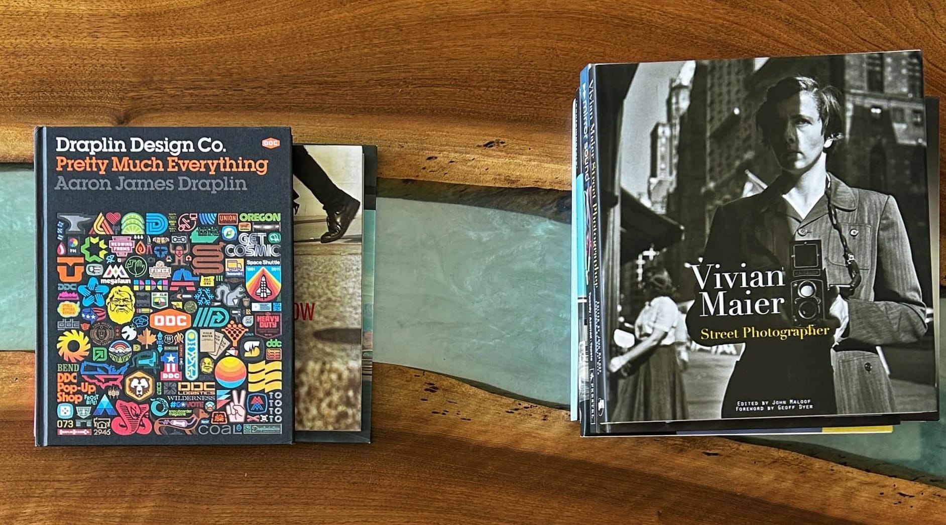 A photo of coffee table books on a coffee table