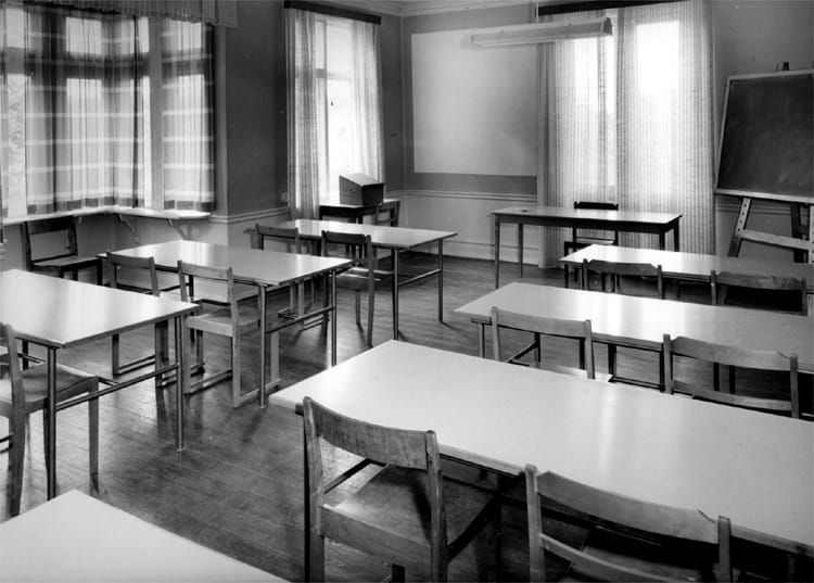 A photo of a classroom - from Klassrumsinteriör. by Borg, Knut - Örebro County Museum, Sweden - Public Domain.