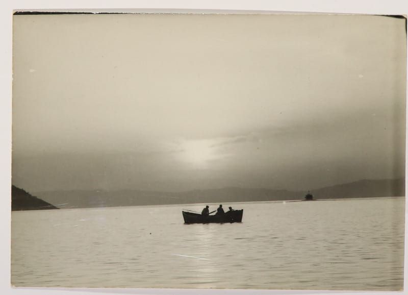 An old photo of people fishing in Greece.