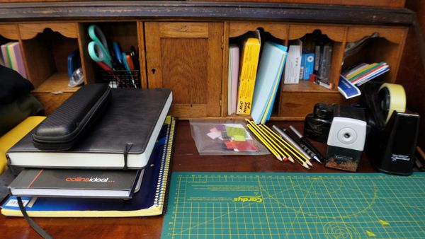 A photo of stationery items on a desk