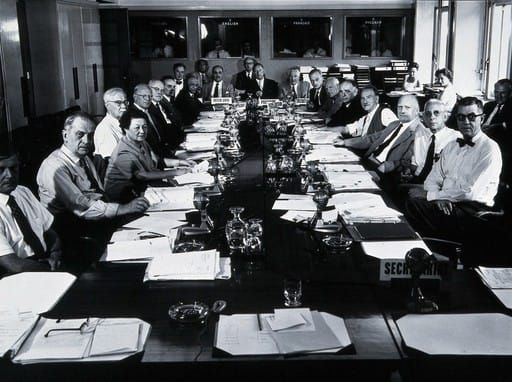 An old photo of people at a WHO meeting