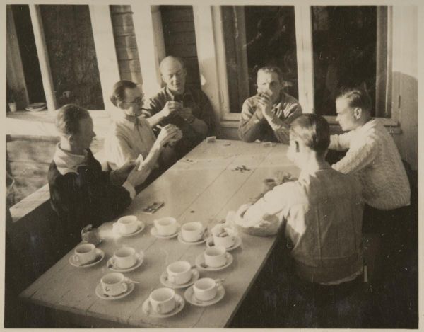 An old photo of people playing cards