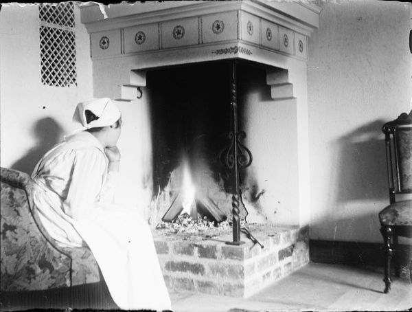 A woman sat at a fireplace - from Upplands Museum, Sweden - Public Domain.