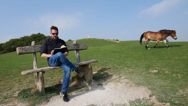 A photo of Rob Lambert Journaling at Danebury Fort