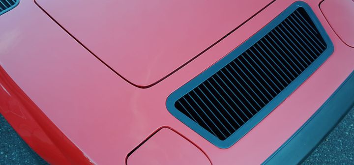 A photo of simple details on a sports car grill