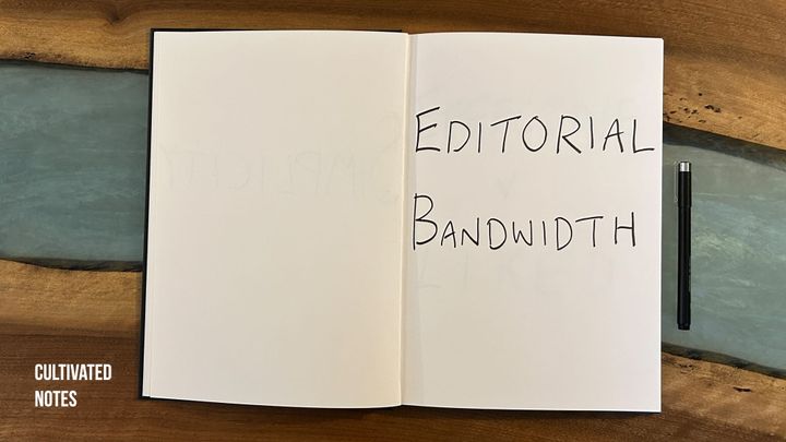 A photo of a notebook with the words Editorial Space written in it