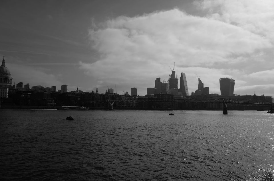 A photo of the London Skyline with the River Thames in the forefront