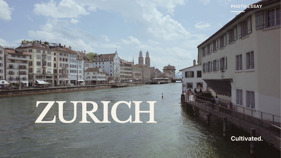 The river running through Zurich, with old churches and buildings along the bank — from a Cultivated photo essay on travel and attention.