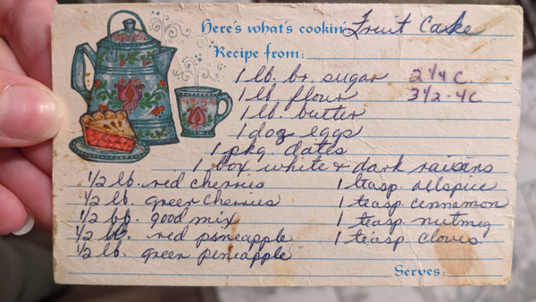 Worn and stained recipe card for "fruit cake" written in cursive.