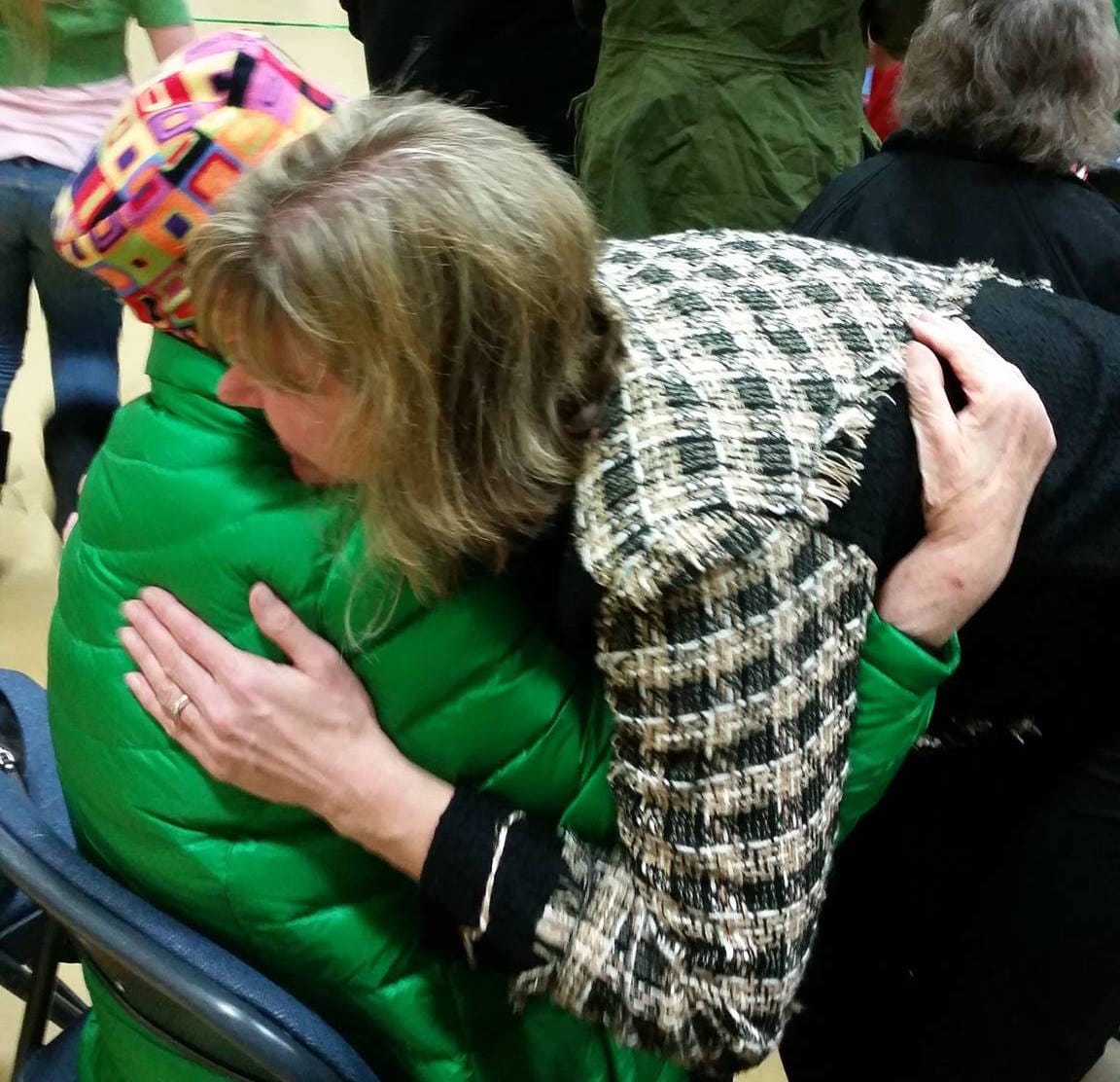 Talkeetna Elementary Principal Lisa Shelby embraces Elinore Ebling, wife of the late Myron F. "Ace" Ebling, for whom VFW Post 3836 is named.  Photo: AJ Sullivan