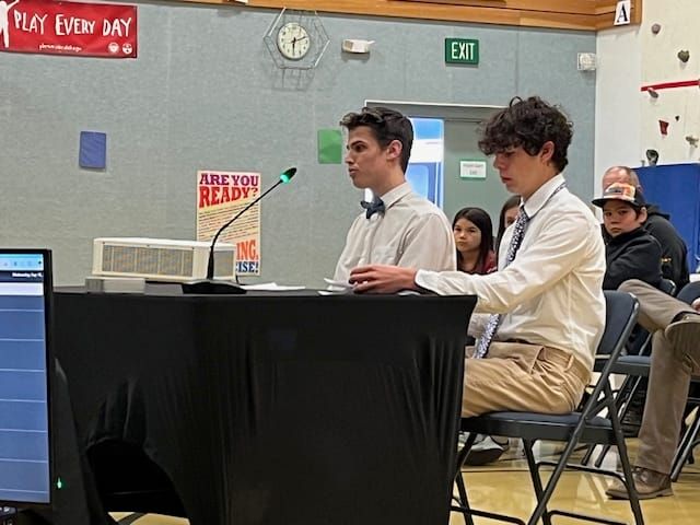 Miles Osmond, Su-Valley High School President and Liam Kaso, Su-Valley High School Vice President present to the Mat-Su Schoo