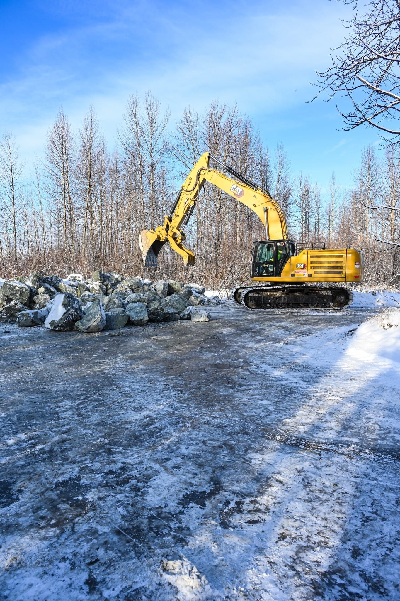 Equipment staged at the end of Main Street in Talkeetna near the river to move rip-rap into place for repairs. Photo: Mat-Su