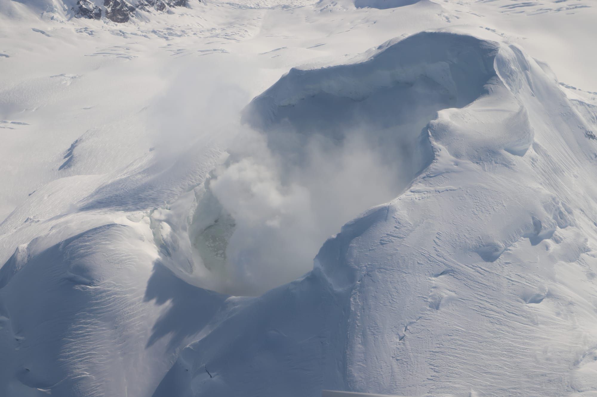 Gas emissions from the summit of Mount Spurr during the 03/11/2025 overflight. The lake is partially visible on the left side