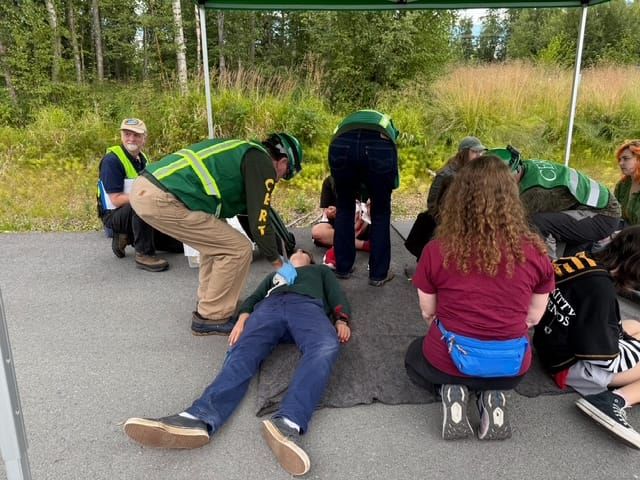 Community members participating in a simulation exercise at the Community Emergency Response Team (CERT) training.