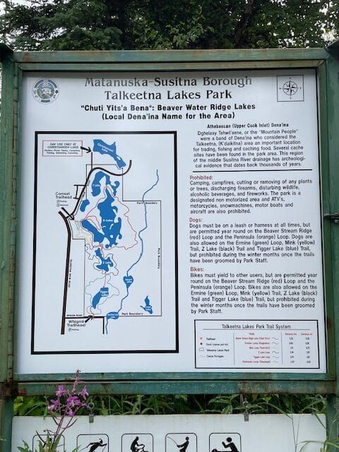 Trailhead sign at Talkeetna Lakes Park with trail information and map.