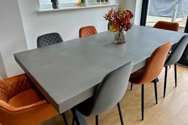 Polished concrete dining table on steel box base 