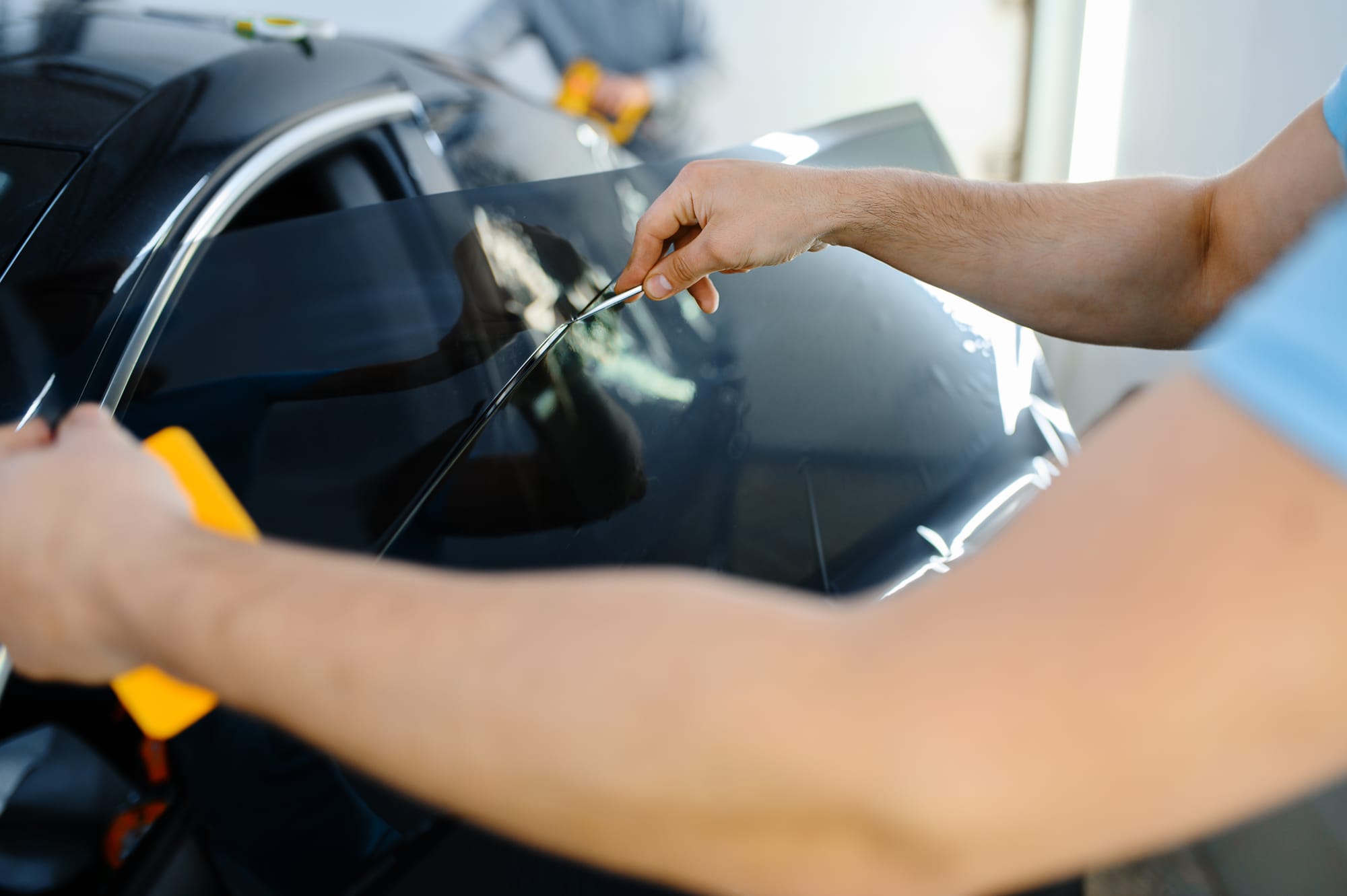 Detail view of automotive window film application