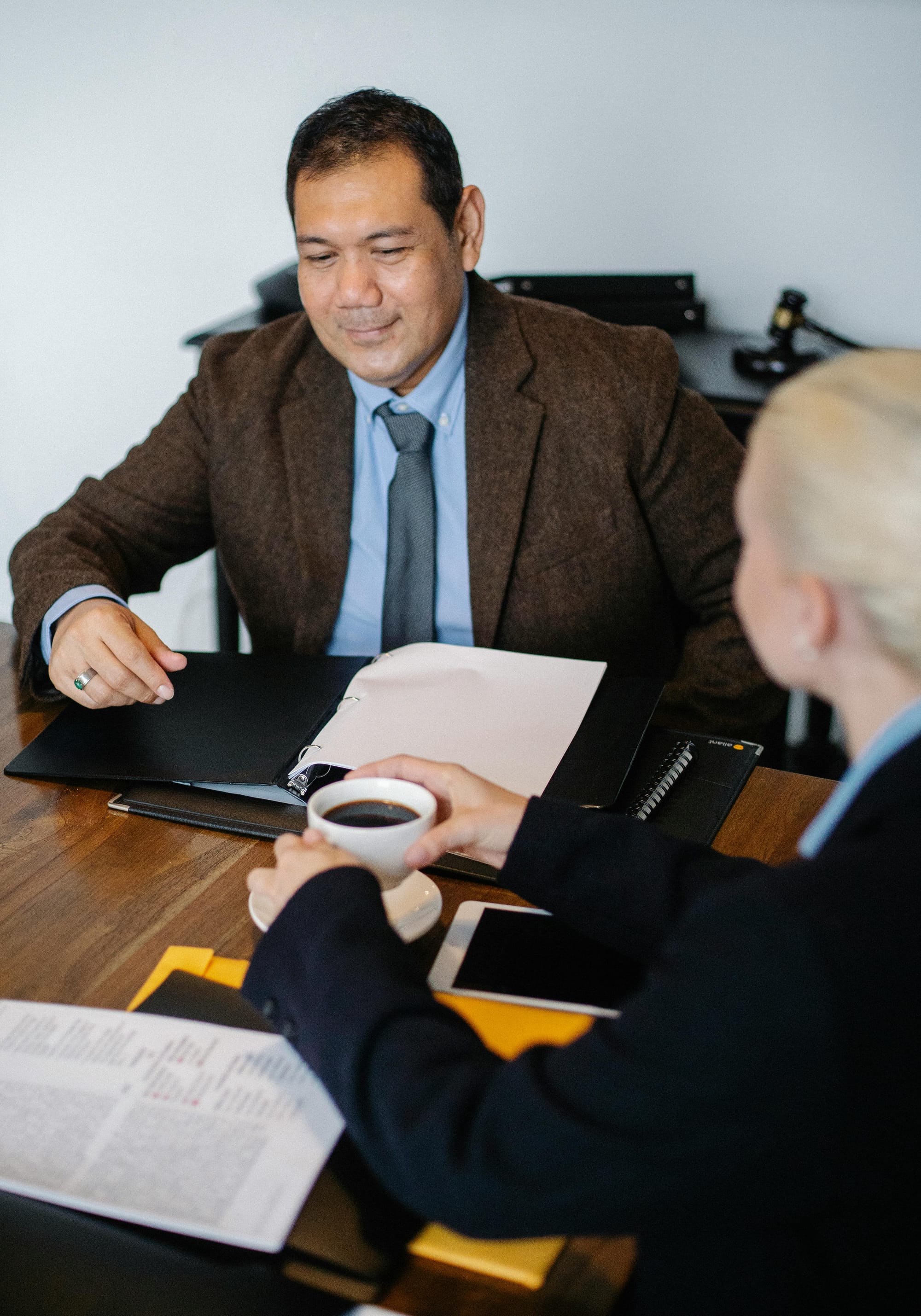 Personal injury lawyer meeting with a client at a conference table