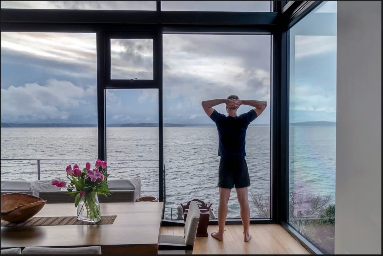 Residential UV protection window film reducing glare and solar heat in a modern home with ocean views.
